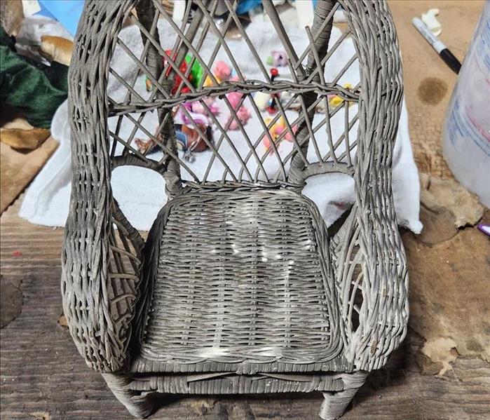 Wicker chair covered soot