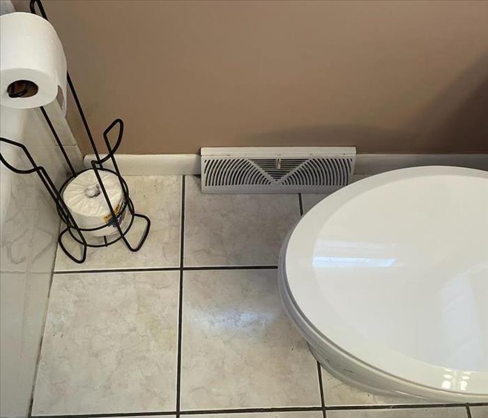 A clean bathroom put back together after the duct and registers were cleaned and reinstalled. 