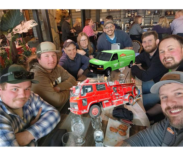 Men from Adamstown Fire Company and SERVPRO of Adamstown, Mohnton gather around a table to catch up.